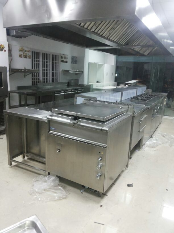 Exhauster System — commercial kitchen exhaust hood with full cooking line installation